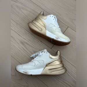 Alexander McQueen two tone gold sneakers